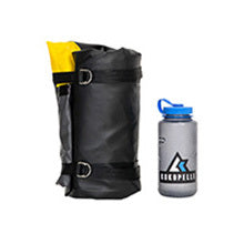 Rolled deflated Rogue-Lite Packraft next to bottle